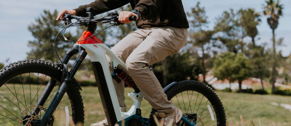 a man riding a Cannondale Moterra full suspension electric mountain bike