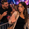female-confronted-by-angry-man-at-concert