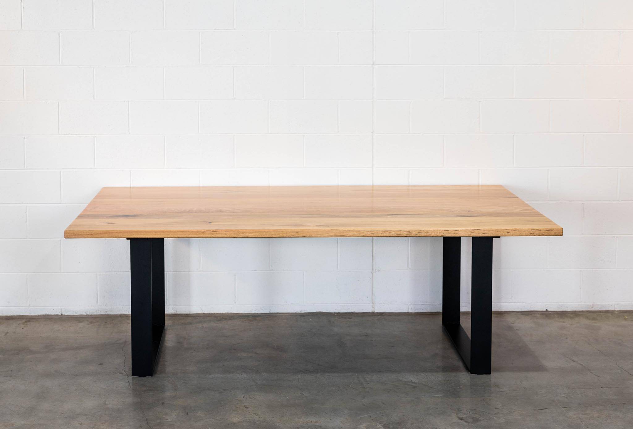 Straightboard Stringybark Clean and Clear. Black Steel Box Ends Dining Table