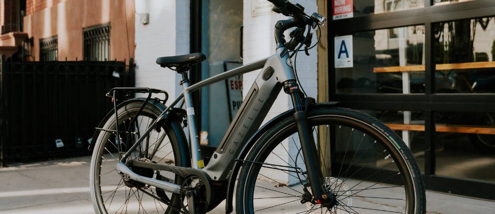 Gazelle electric city bike on sidewalk