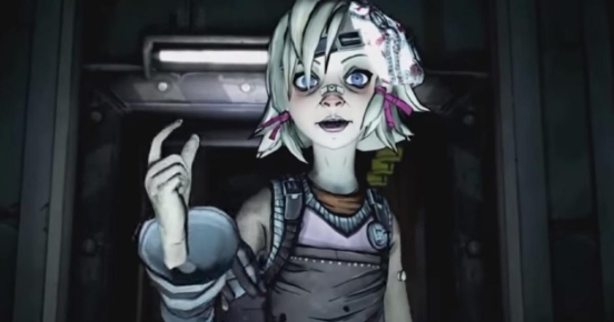 Tiny Tina, with her short blonde hair and young looks, standing in a hallway with her hand in the air as she is talking.