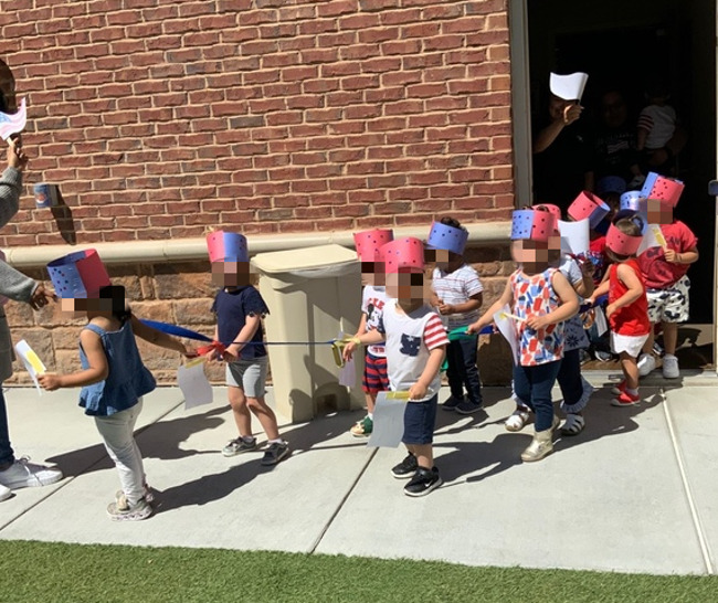 students participating in our red, white, and blue parade