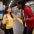 female-confronted-by-angry-man-subway-platform