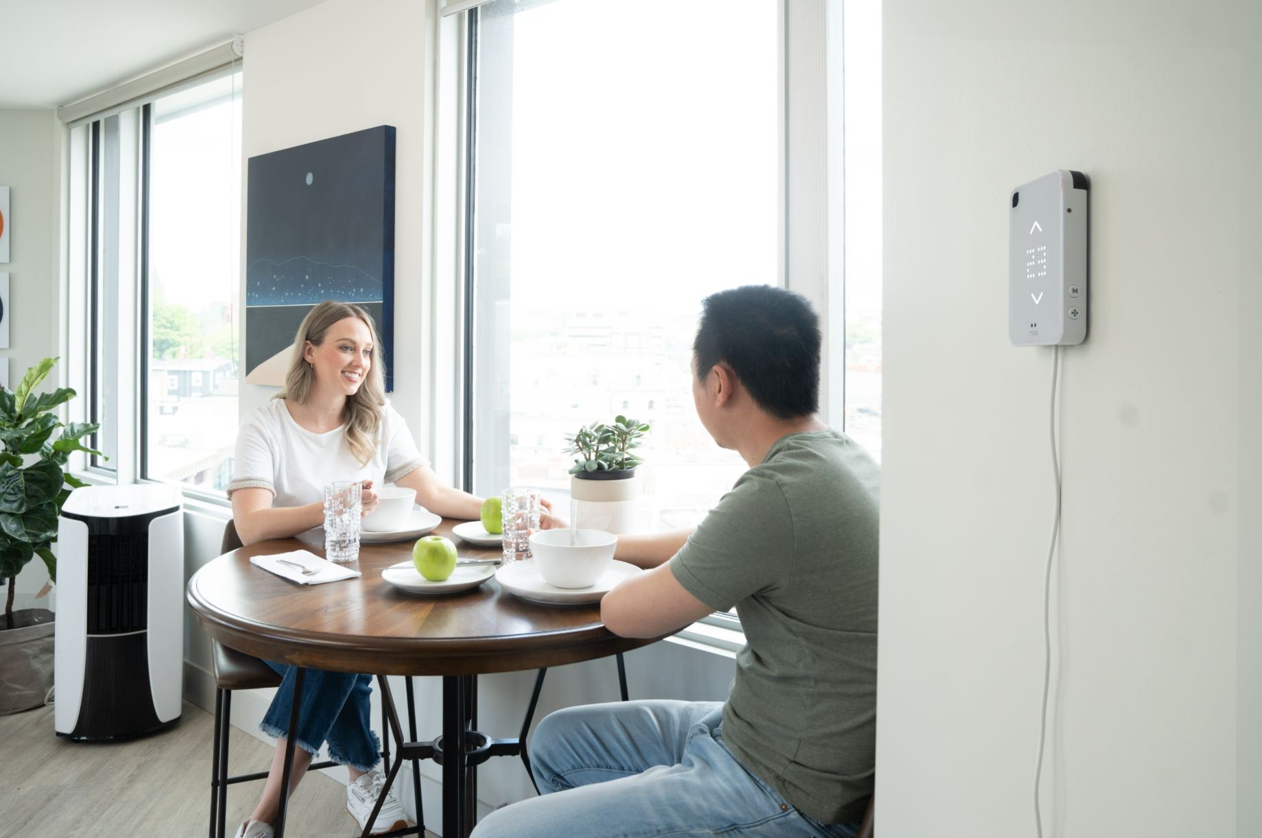 couple enjoying savings from smart thermostat control 
