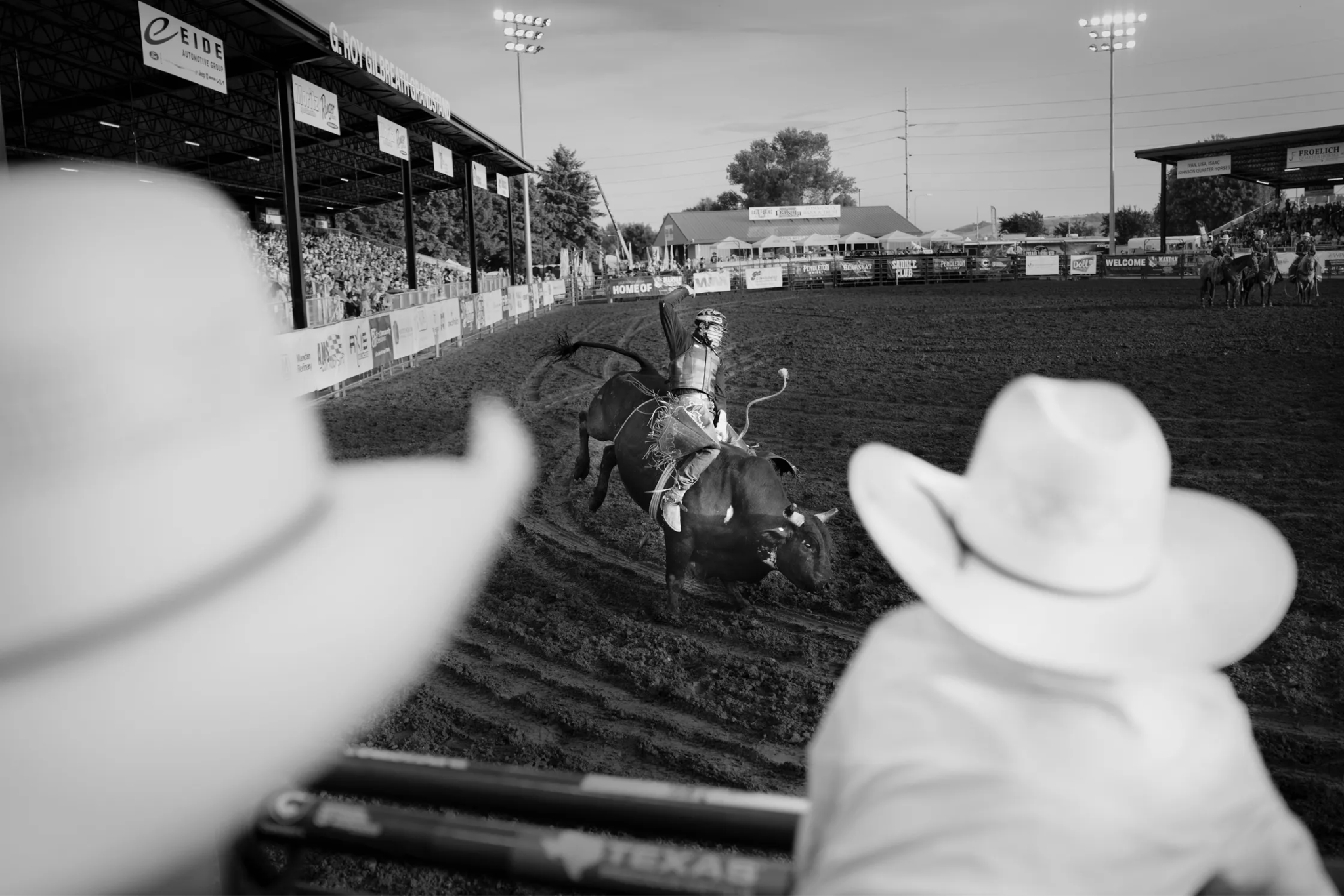 A person riding a bull.