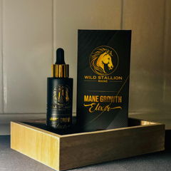Mane Growth Elixir bottle and box in a wooden tray