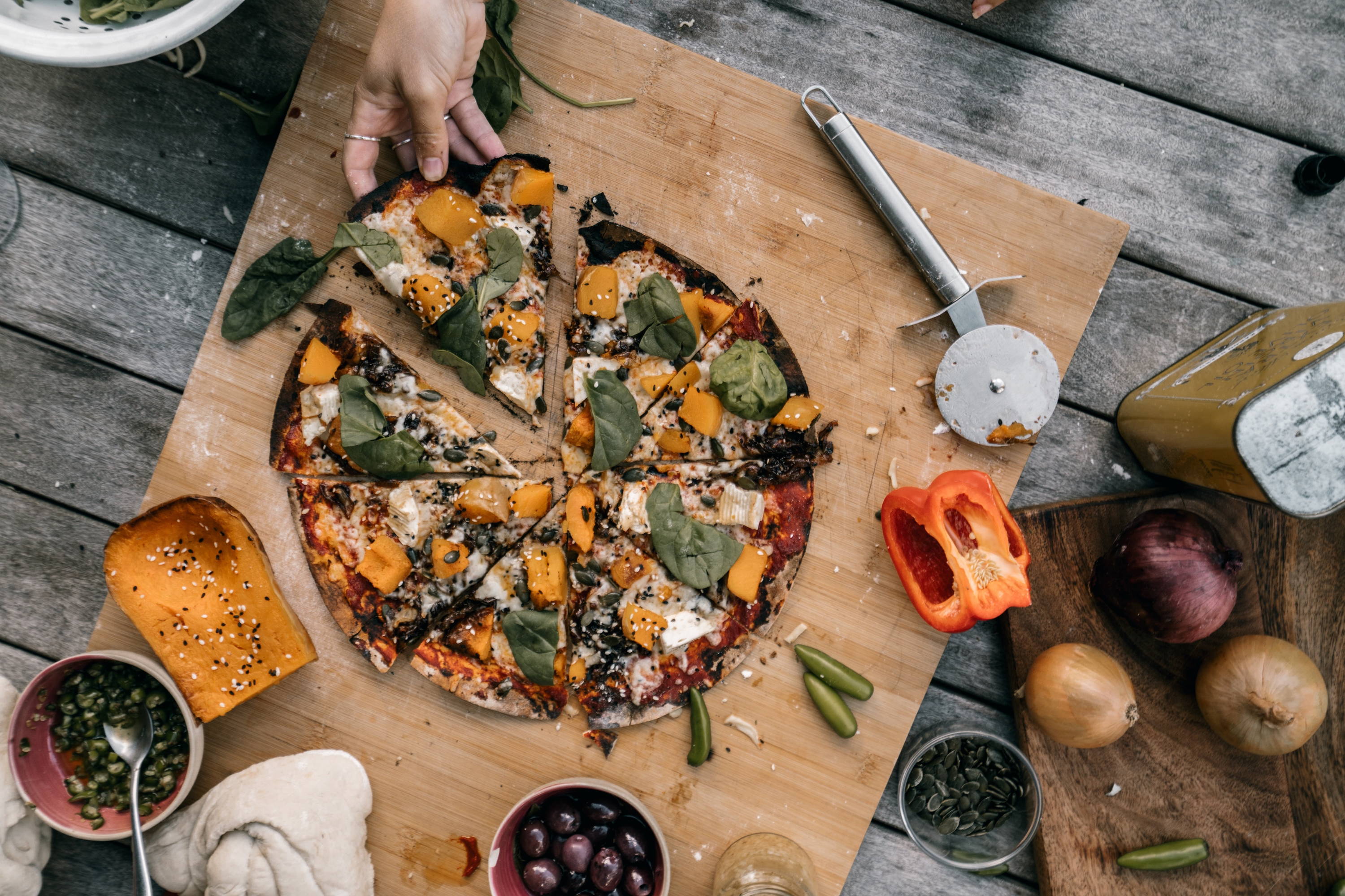 Italian style pizza topped with spinach and pumpkin to pair with Wild Kiss of Wine Dolcetto.