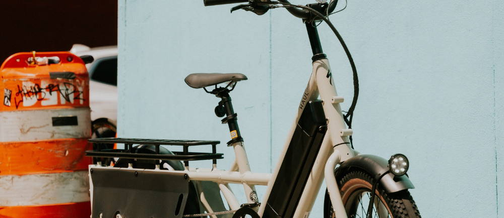 A white Specialized Globe Haul electric cargo bike