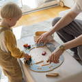 Father and son playing with the Montessori Track Builder Kit. 