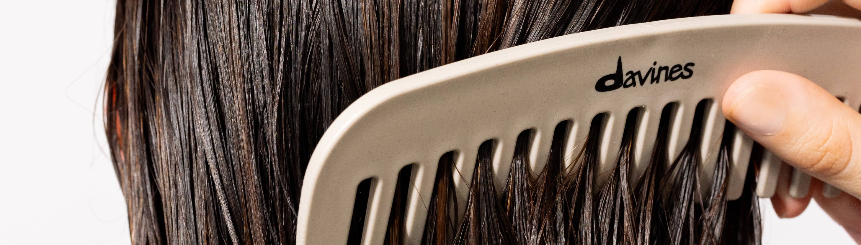 Davines comb brushing through damp hair
