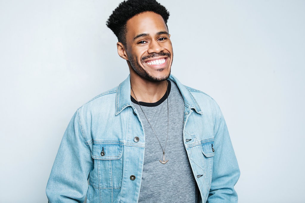 Jay Jurden smiling against a plain background.