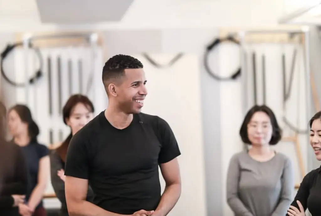 Image of Brett Howard smiling while talking to a class