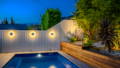 Halo exterior wall lights illuminating boundary walls at night