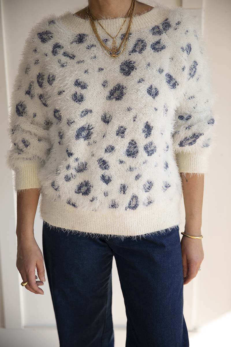 White sweater with blue leopard print pattern mindfully sourced for Cura Found in Seattle, Washington