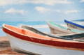 Giclee art of seven row boats on the beach