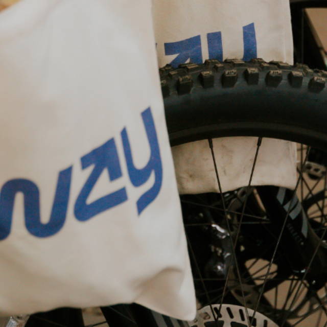 Upway tote bag and electric mountain bike tire