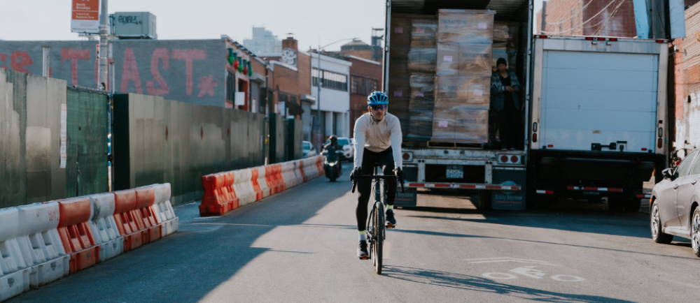 A man riding an electric road bike on a city street