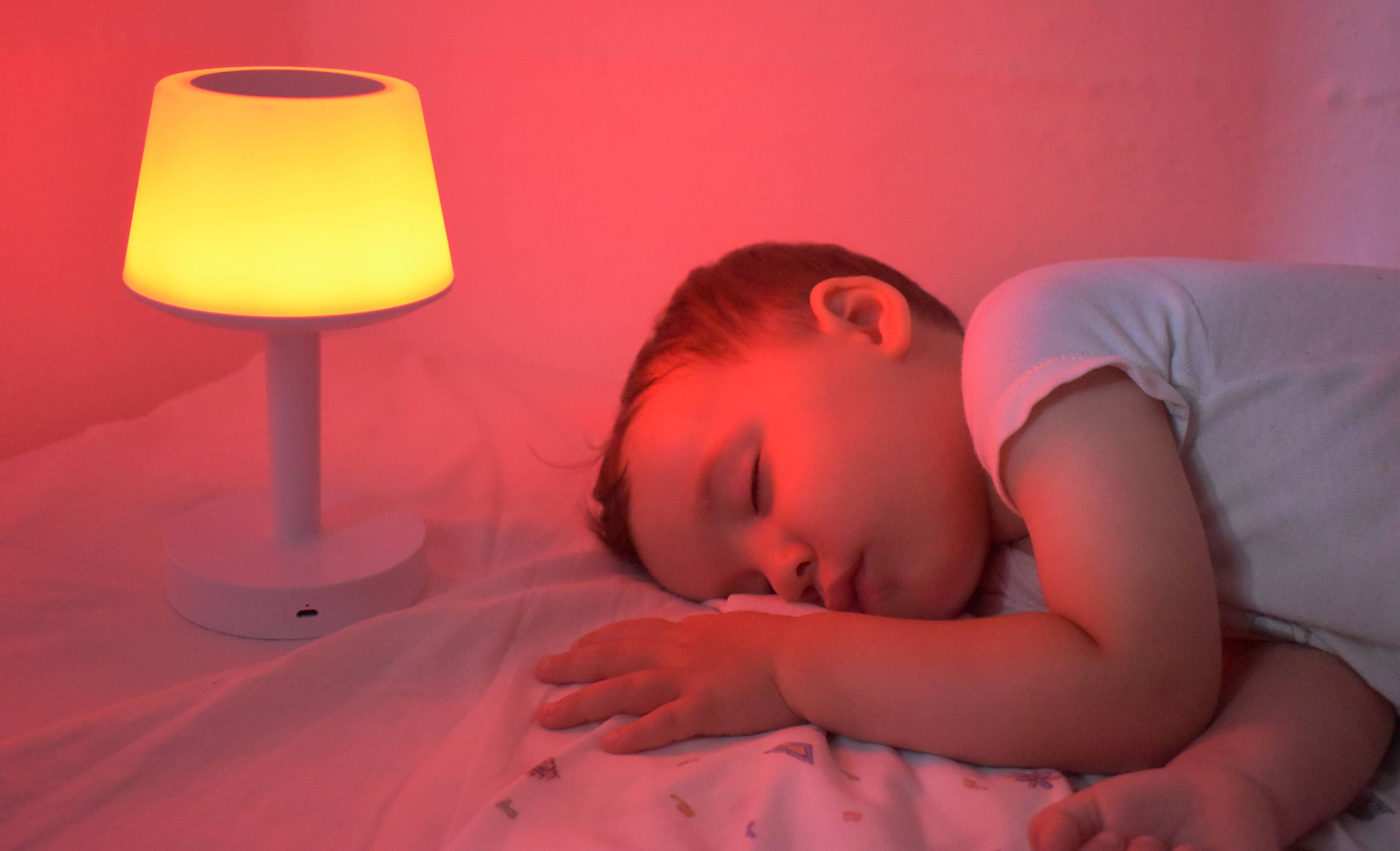 Baby sleeping next to Baby Mood Lamp