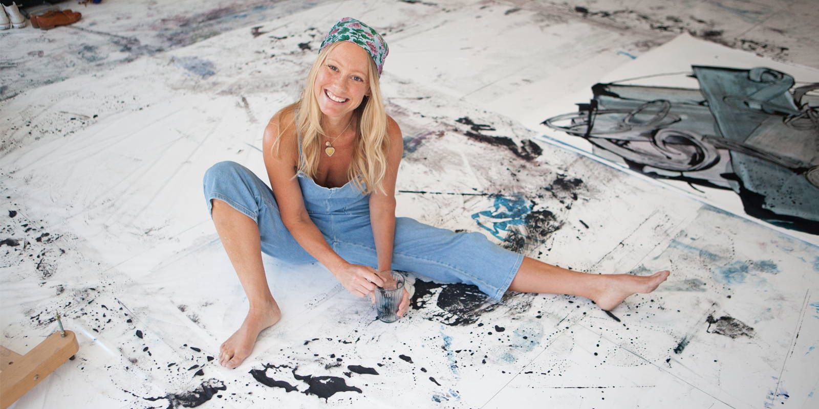 Lisa Oxenham sat on a white painted floor