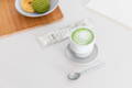 Matcha latte in a ceramic cup.