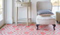 coral summerhouse rug with chair and table