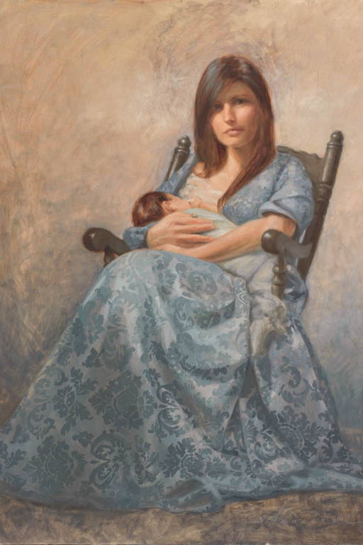 A woman sitting in a rocking chair breastfeeding an infant.