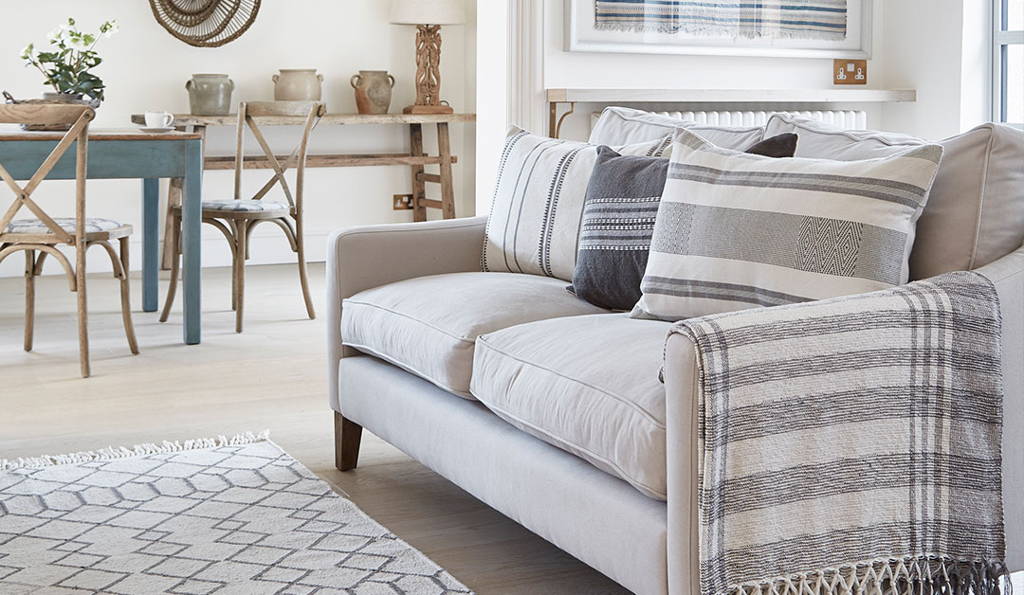 eivissa monochrome cushions, throw and rug in living room