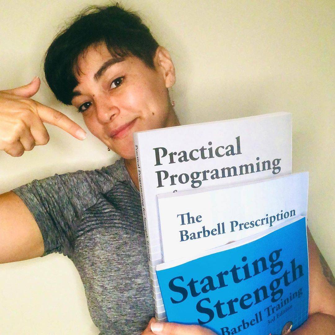practical programming for strength training book in hand