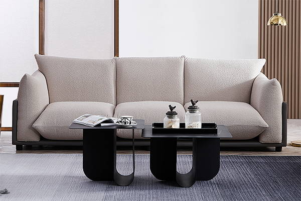 light grey boucle sofa and black coffee table