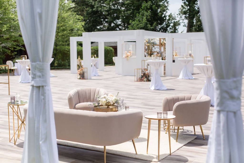 blush lounge seating with gold side tables 