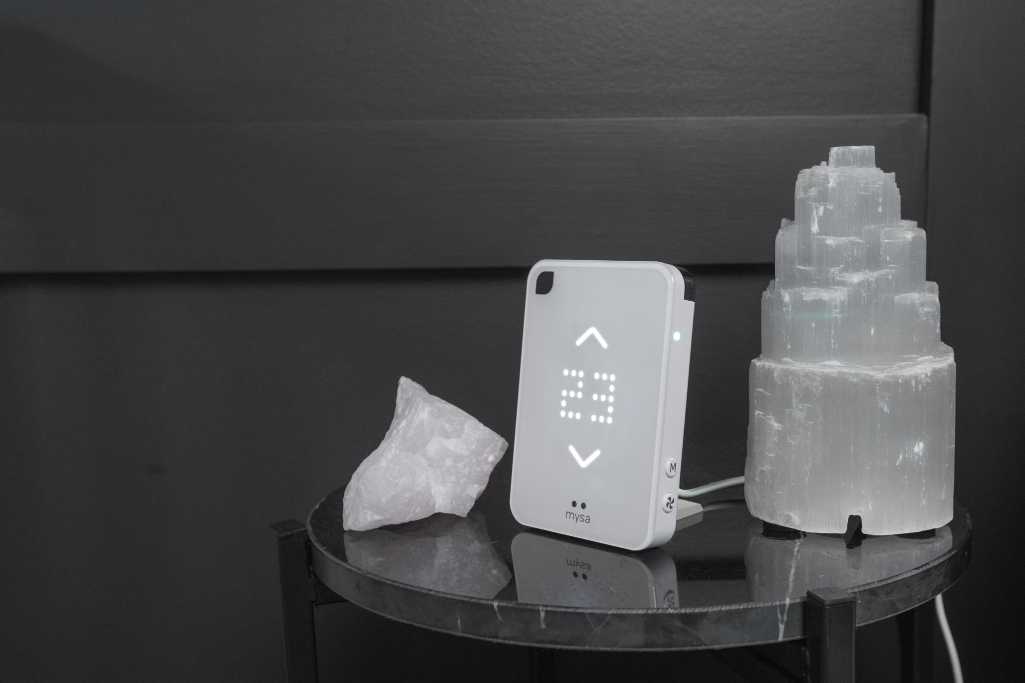 smart AC controller on side table