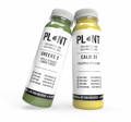green cold pressed juice and pineapple cold pressed juice