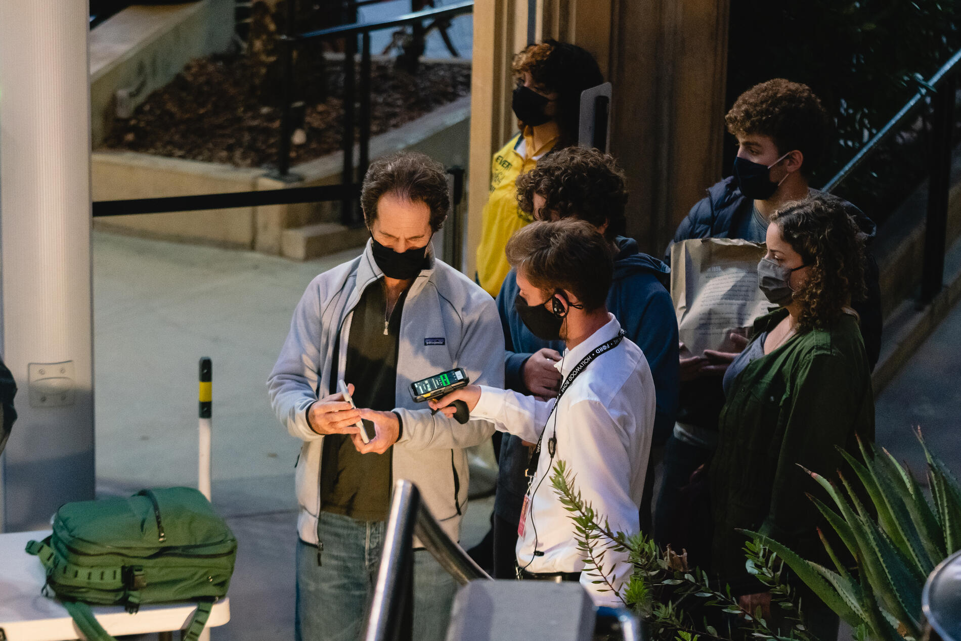 A staff member scans in concert attendees via their Ford mobile apps