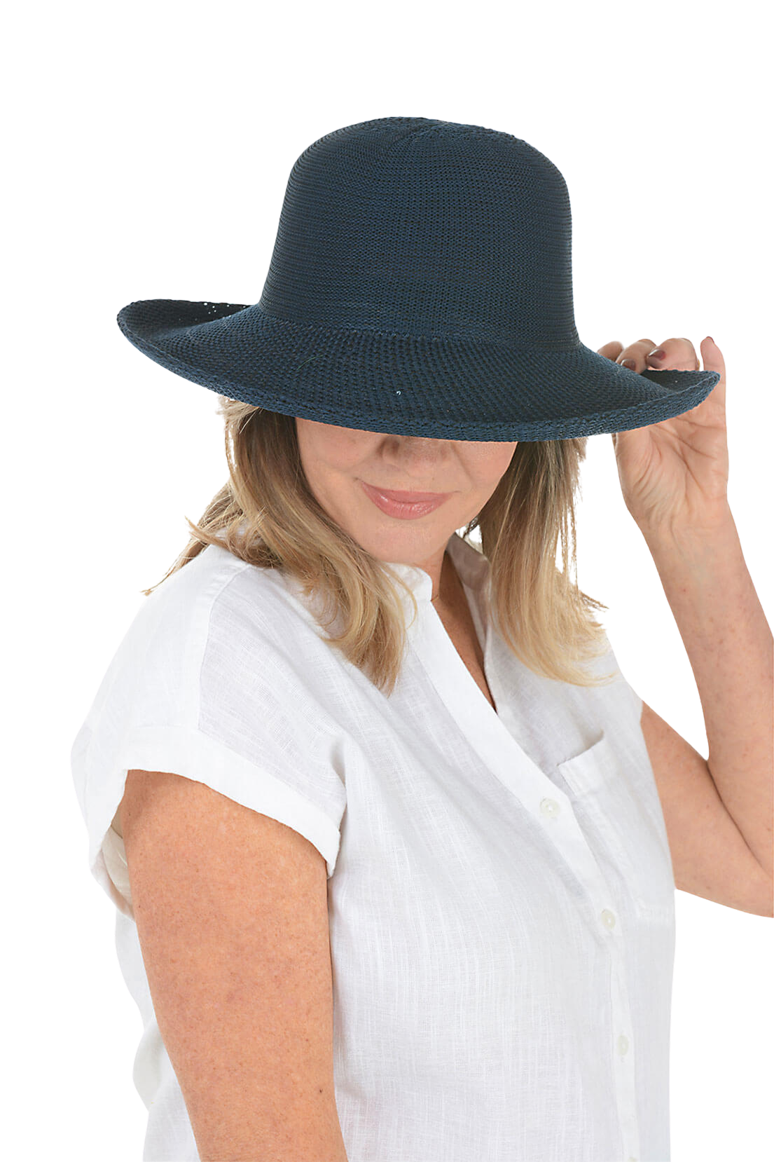A woman wears a black travel hat.