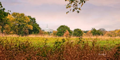 Picture of the Nauvoo Temple from across an autumn field. 