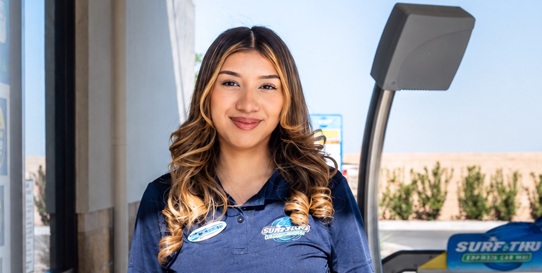 Surf Thru Express team member greeting a guest