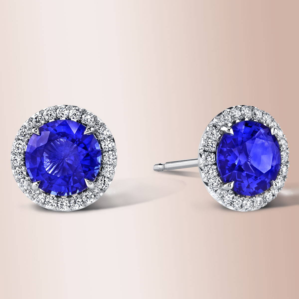 Sapphire stud earrings with diamond halo.