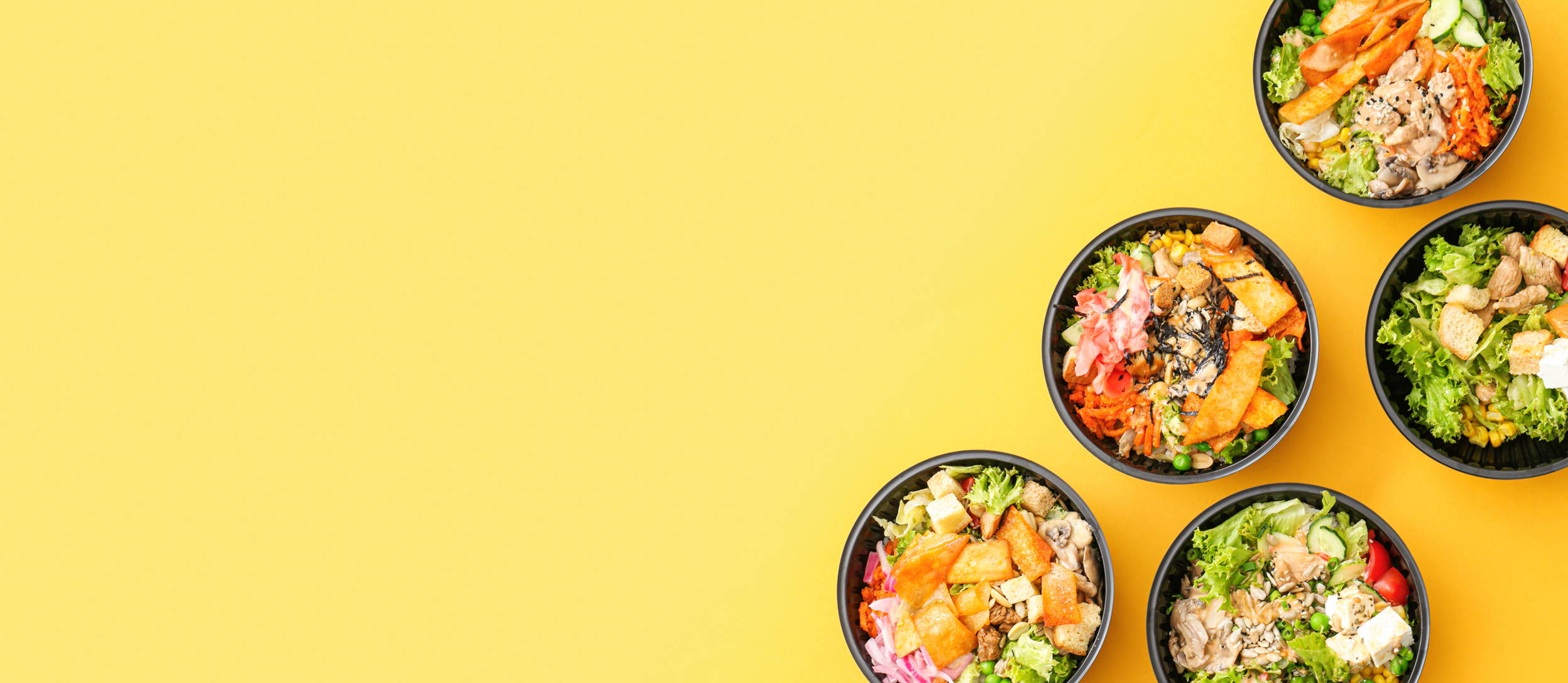 Various salads, grain bowls, and sushi bowls for Confetti's Virtual Team Lunch