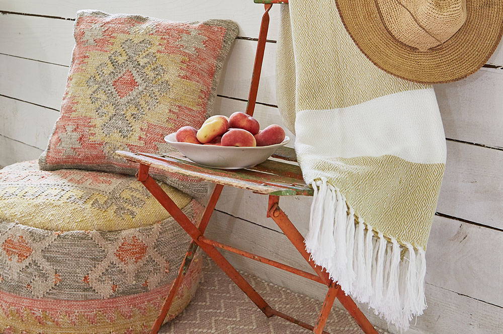 Nomad Tarifa cushion and footstool with gooseberry hammam throw and dormouse chenille rug