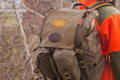 close up of a man wearing an isle royale pack with a USA buckskin patch out in the woods