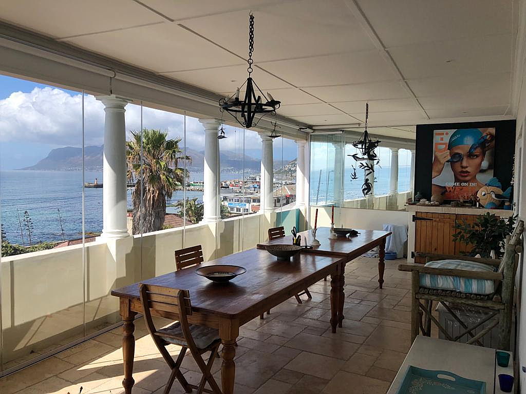  Kalk Bay
- The unobstructed sea views from this top floor lock up and go apartment are absolutely mind blowing. Situated in a small secure complex right in the heart of the village, you can enjoy watching the Kalk bay reef surfing action, the whales playing in the bay and the fishing boats coming in and out of the harbour all from your very own front row seats!
This wonderful apartment comprises of an open plan kitchen, living room opening onto a spacious enclosed balcony / dining and sitting area with f
