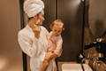Mother and toddler getting ready.