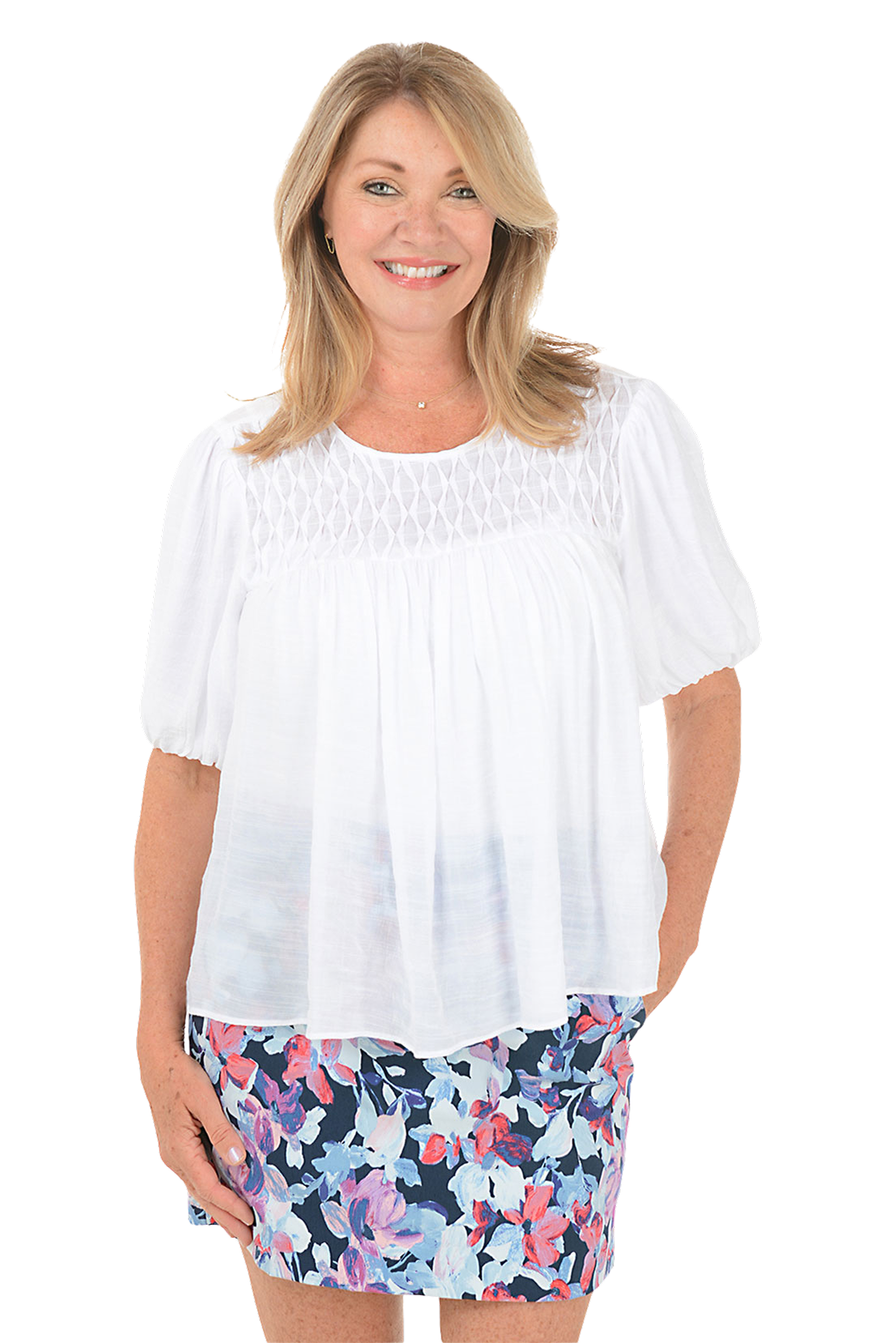 A woman wears a white diamond pintuck puffed sleeve blouse.