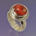 ashes into glass memorial ring in silver. featuring a red glass stone by jeweller Chris Parry