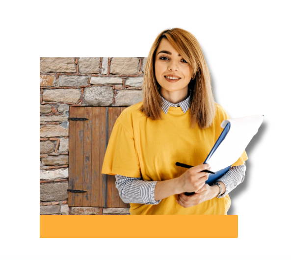 Woman in a yellow shirt holding a clipboard, standing in front of a historic stone wall with a wooden shutter—representing historic masonry inspection or restoration assessment.
