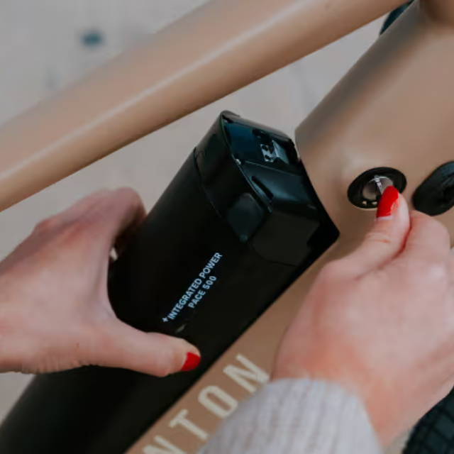 a battery being placed in an Aventon e-Bike
