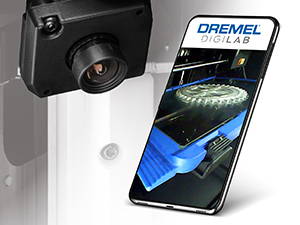 Image of Dremel 3D45 camera with iphone next to is showing the progress of a 3D printed gear