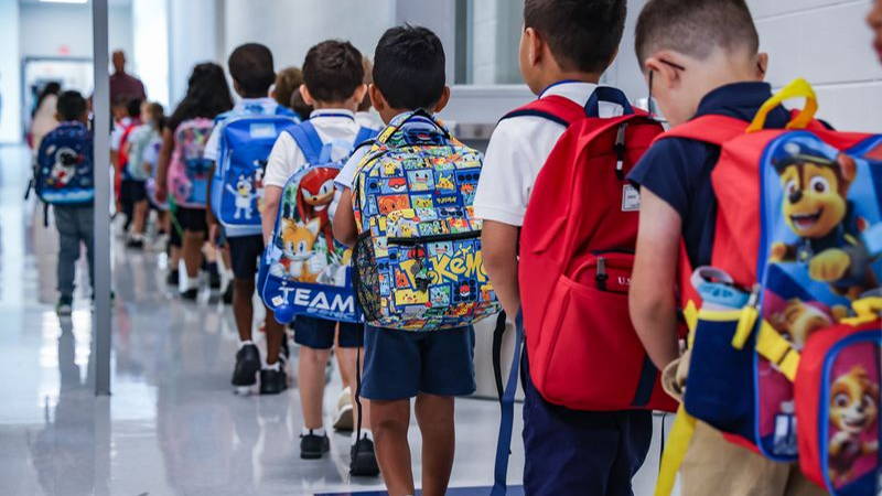 Kids lined up for their first day of school.