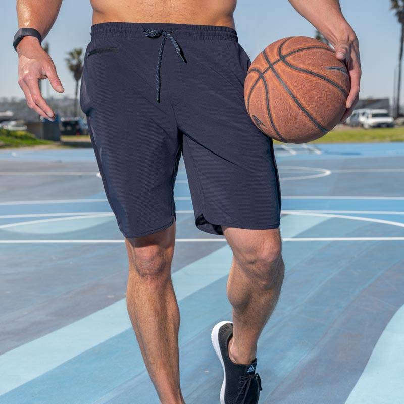 Man playing basketball while Black Clover Performance Shorts