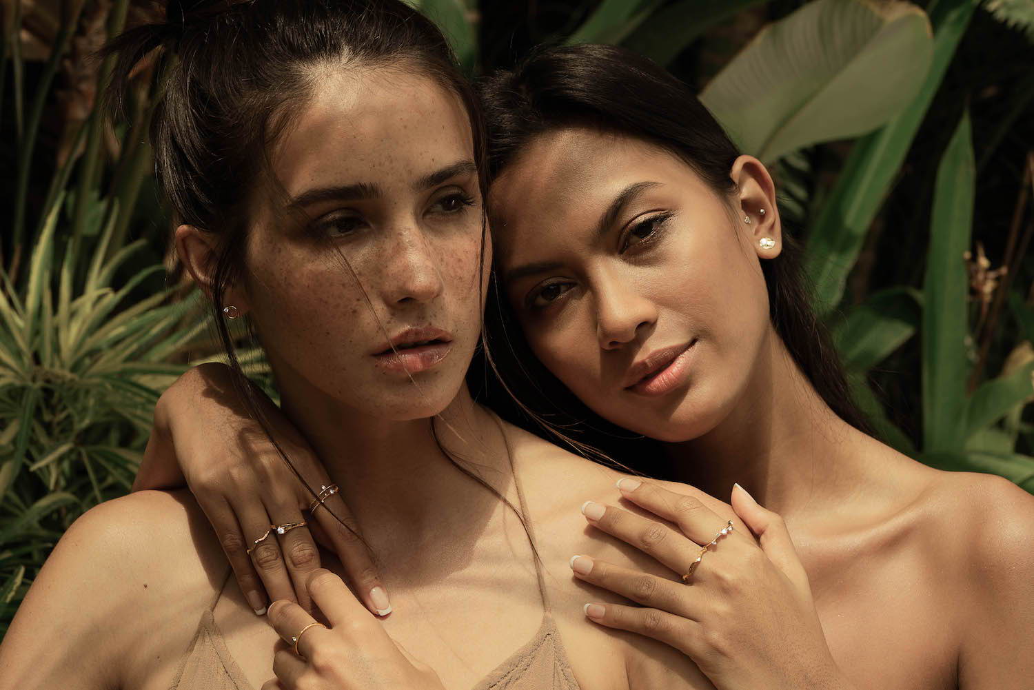 Woman wearing Scéona rings and earrings in a pensive mood